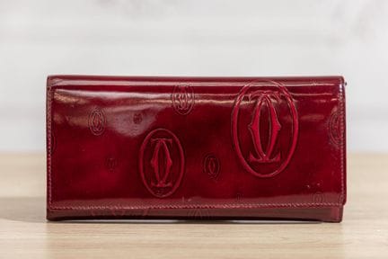 CARTIER - Portefeuille-porte cartes en cuir vernis