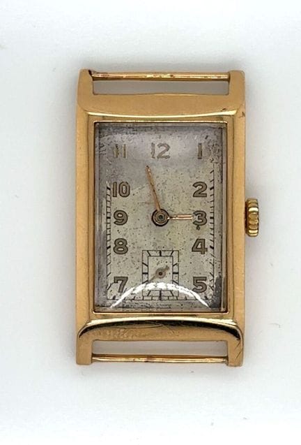 Gold watch case (750‰), rectangular bezel, silver 