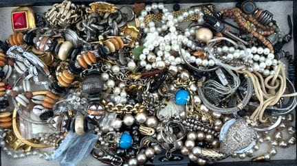 A set of costume jewelry including: necklaces, bra