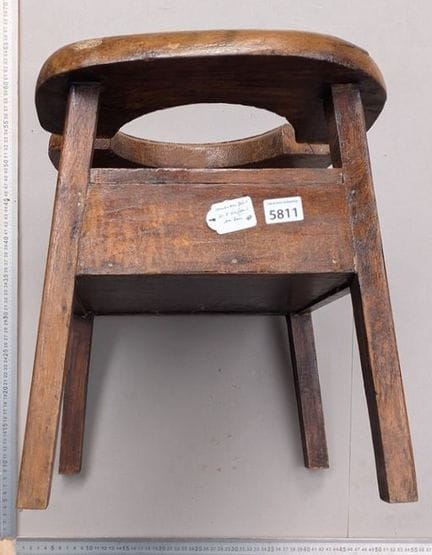 A small wooden children's toilet, 18th century—see