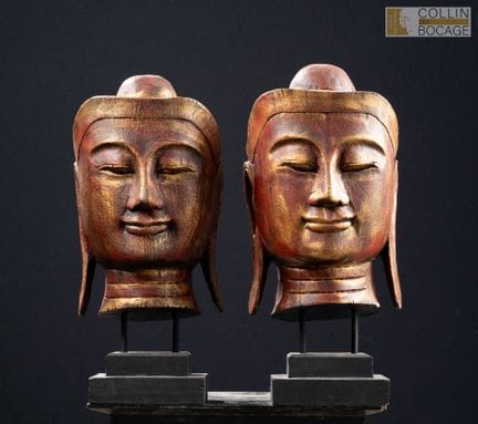 缅甸，20世纪下半叶。两尊涂成红色的木制佛头。高：40厘米