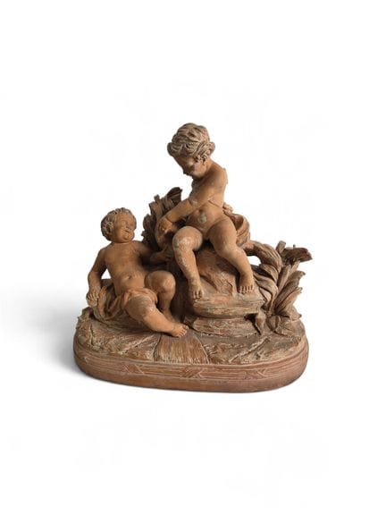 Lovers. 19th century. Patinated terracotta, bears 