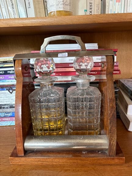 a tray holding two cut-glass bottles