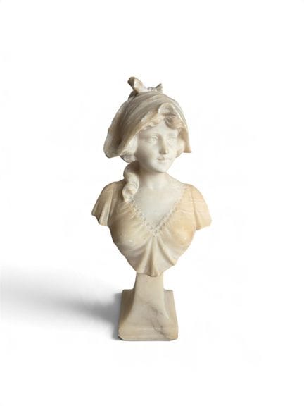 Bust of a young girl on a pedestal. Alabaster. Cir
