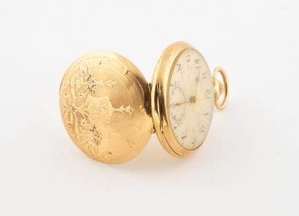 Orologio da tasca in oro cesellato e guilloché 750