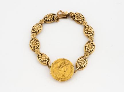 Bracciale articolato in oro 750°/°° con maglie a f