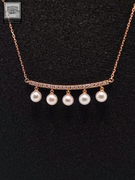 Collier en or rose 750°/.(18K) 3g10 serti de 5 per