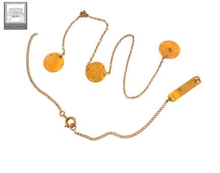 Lot d'or 18K 750/°°° comprenant : 
- Chaînette, po