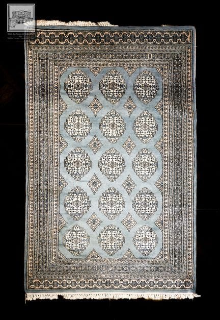 Tapis en laine 
Couleur vert - décor de motifs géo