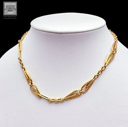 Uhrenkette 
18 Karat Gelbgold 750/°°°
Adlerkopf-Pu