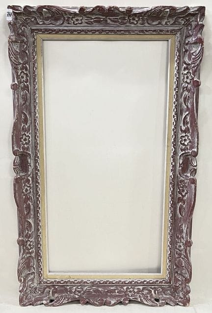 A carved wooden frame. 
H 122 x W 72 cm
H 100 x W 