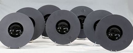 REVOL FRANCE 
Set of seven black porcelain plates,