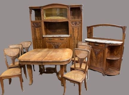 LOUIS CHAMBRY - A molded walnut dining room carved