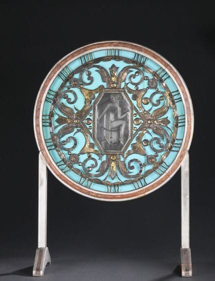 Circular decorative piece made of openwork metal a