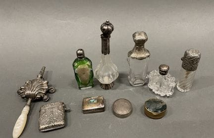 Set of salt shakers with silver plated metal lids,