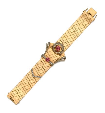 BRACCIALE RETRÒ CON RUBINI E DIAMANTI

Provenienza