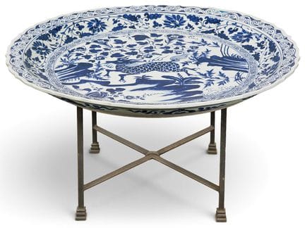Coffee table made from a large Chinese plate in bl