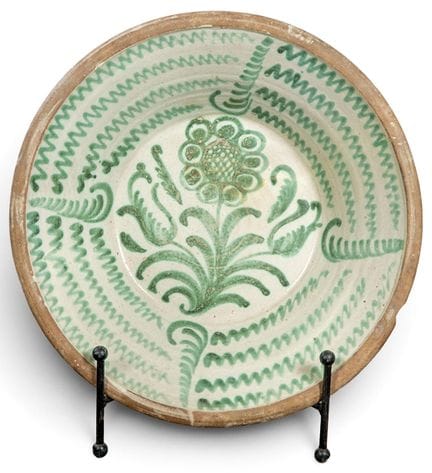 Fajalauza glazed ceramic bowl on a creamy white ba