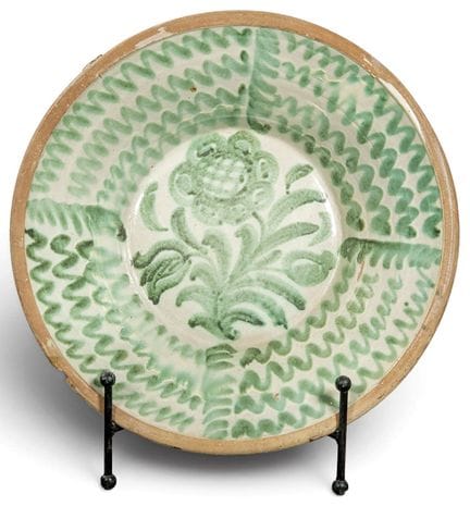 Fajalauza glazed ceramic bowl on a creamy white ba