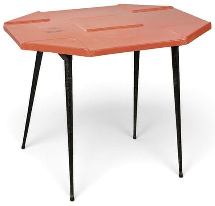 Table with an octagonal fiberglass top in a red fi