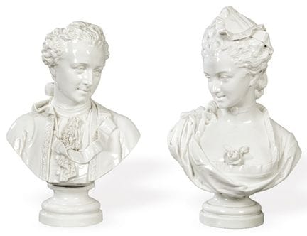 Pair of male and female busts in white glazed porc