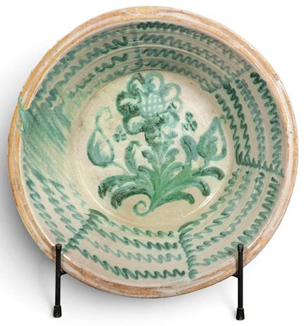 Fajalauza glazed ceramic bowl, on a creamy white b
