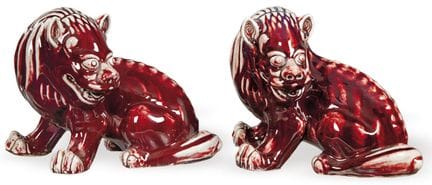 Pair of Foo lions in Oxblood glazed Chinese porcel