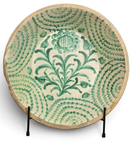 Fajalauza glazed ceramic bowl on a creamy white ba