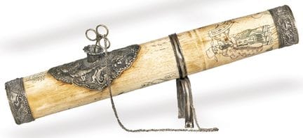 Pyrographed laminated bone and silver opium pipe. 