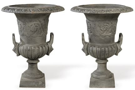 Pair of cast iron Medici-style garden glasses. 
 D