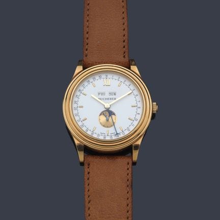 BUCHERER Herrenuhr mit vergoldetem Gehäuse. 
 Weiß
