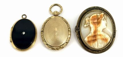 Set of three pieces of costume jewelry: a photo lo
