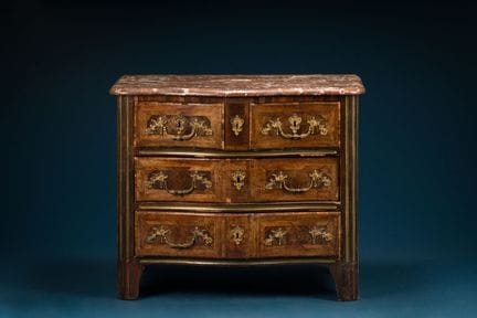 A slightly curved chest of drawers made of rosewoo