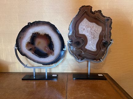 TWO AGATES in cross-section, mounted on a base.
He