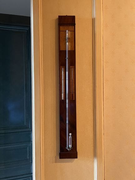 BAROMETER made of mahogany and light-colored wood 