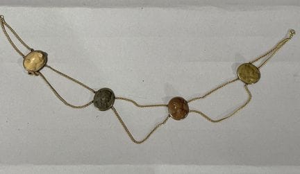 A necklace with two rows of chains, made of gold-p