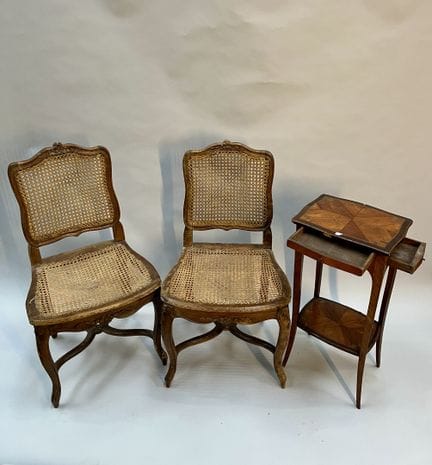 PAIR OF CANE-SEATED CHAIRS in carved walnut with f