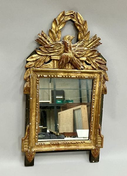 SMALL MIRROR with a gilded wooden pediment.
Louis 