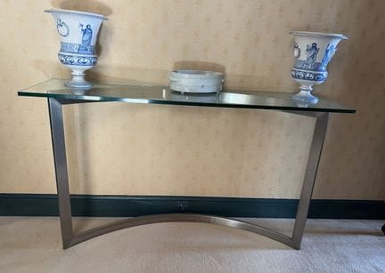 SIDE TABLE made of chrome-plated metal with a glas