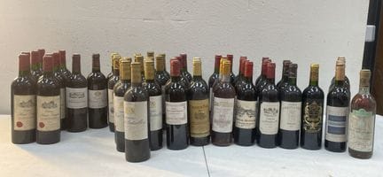 53 botellas: 
4 botellas de Château Marquis de Ter