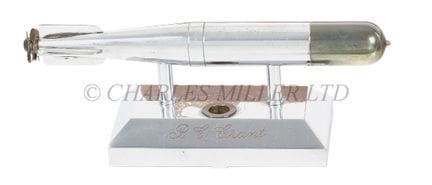 A TORPEDO-MOUNTED PEN REST, CIRCA 1950

the torped