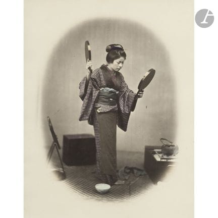 Felice Beato (1832–1909) 
Geisha checking her hair