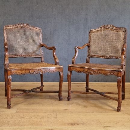 TWO CANE ARMCHAIRS that may form a Regency-period 