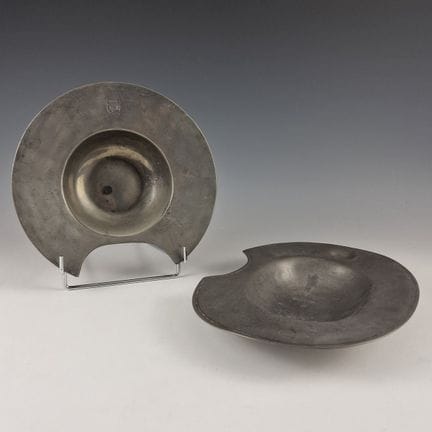 SET OF TWO PEWTER BARBE PLATES: one round plate wi