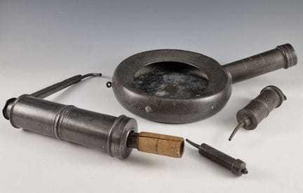 SEVEN pewter enema sets, including one SOIT-MEME f