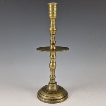Bronze TORCH. Circular base; turned shaft with bal