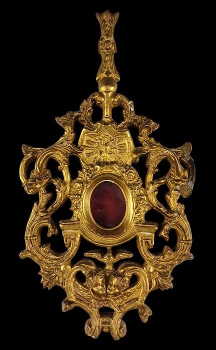AFFASCINANTE CORNICE-RELIQUARIO dalla forma sinuos