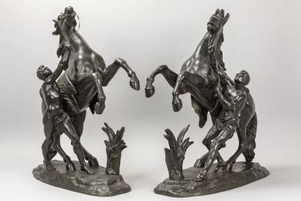 pair of sculptures in black patinated metal after 