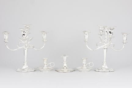five silverplated candlesticks, with two pairs

Lo