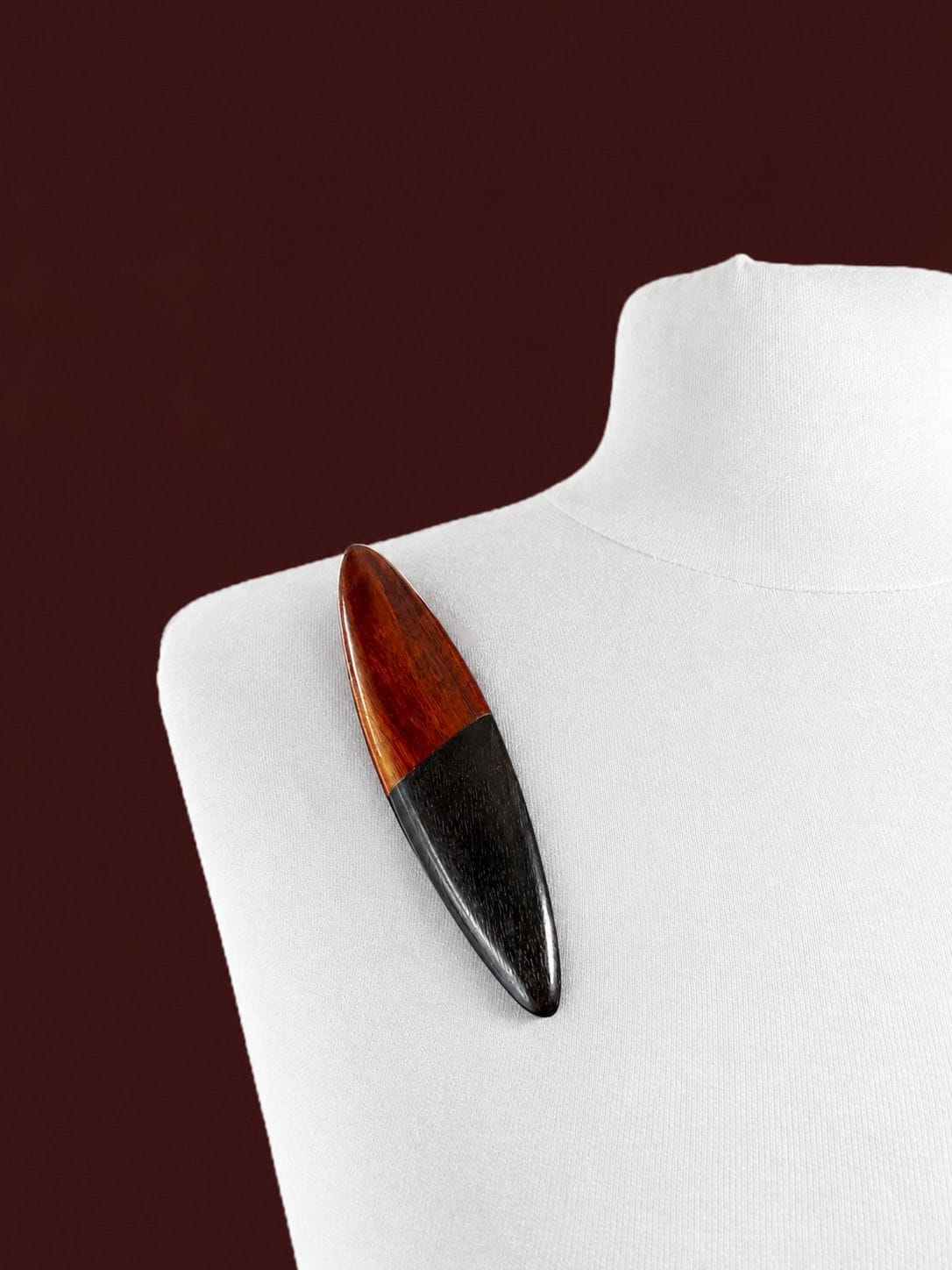 CATHERINE NOLL Two-tone wooden shuttle brooch—signed C.T.NOLL
Length: 11.5 cm